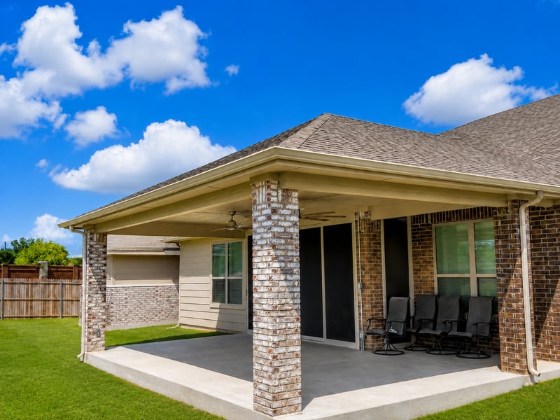 Custom hip ridge patio cover with extended concrete patio in Northlake Texas